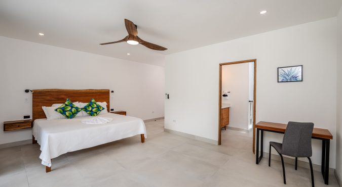 Isabel bedroom with desk and bathroom